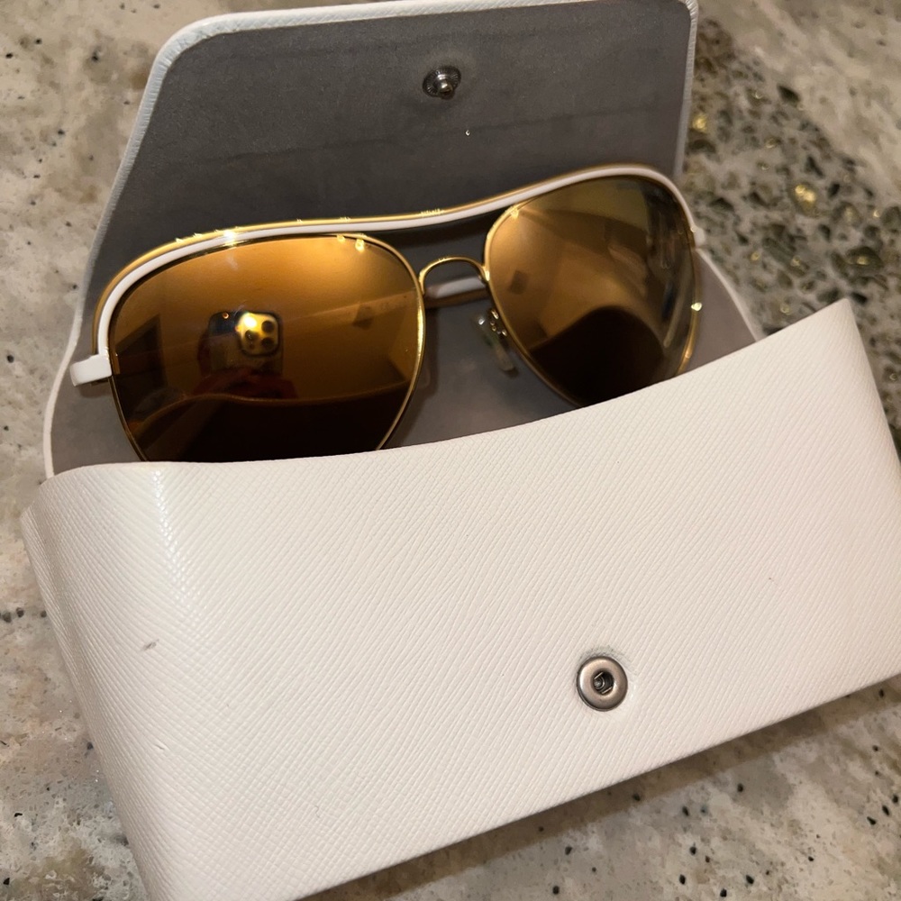 Michael Kors gold and white mirrored sunglasses.